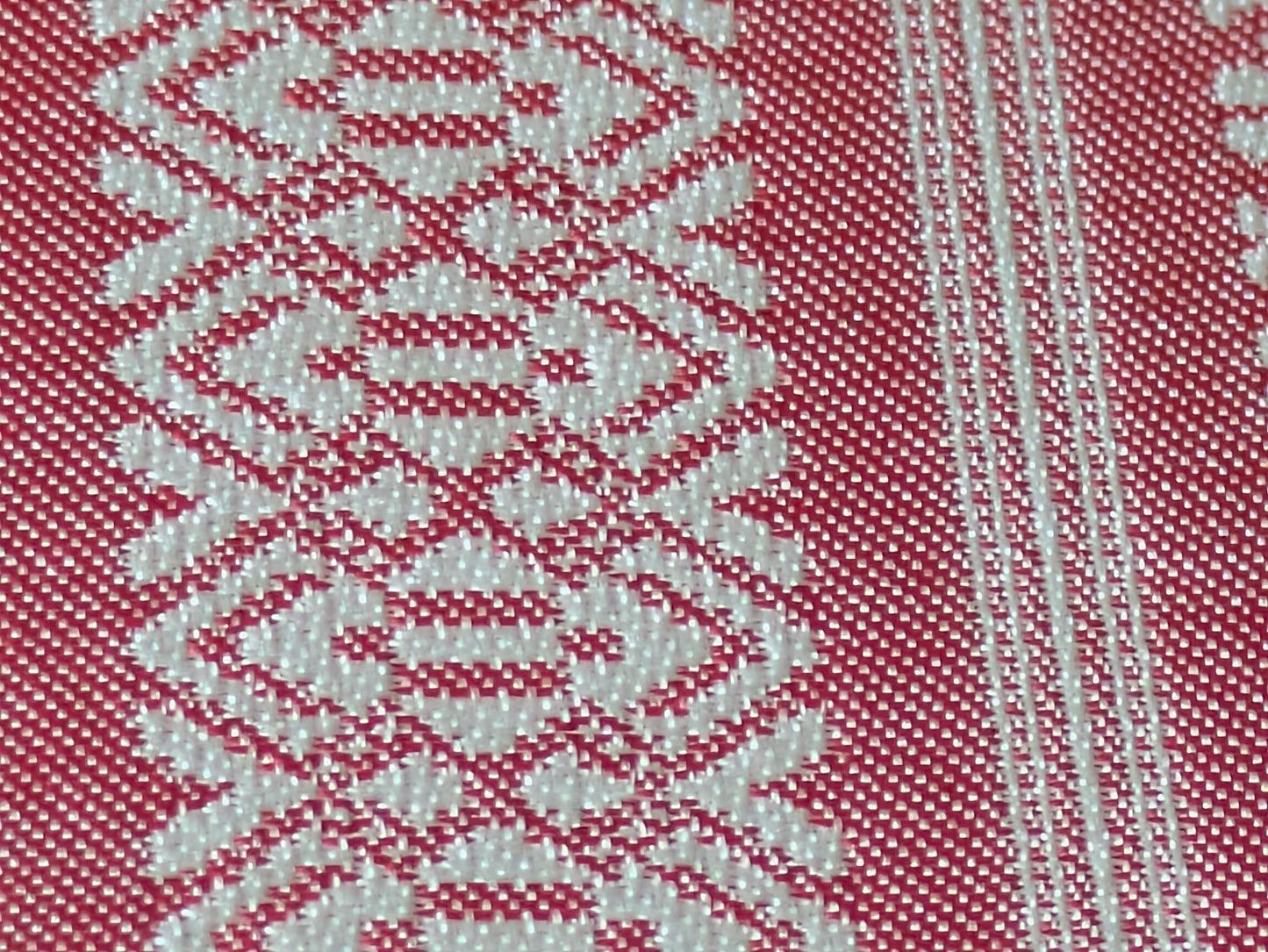 Close-up of the pink Kenjo-pattern Hakata-ori silk weave