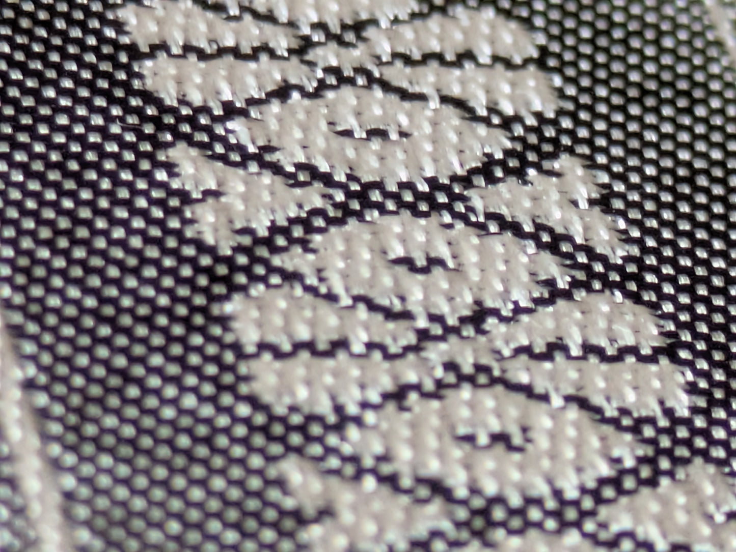 Close-up of the gray Kenjo-pattern Hakata-ori silk weave
