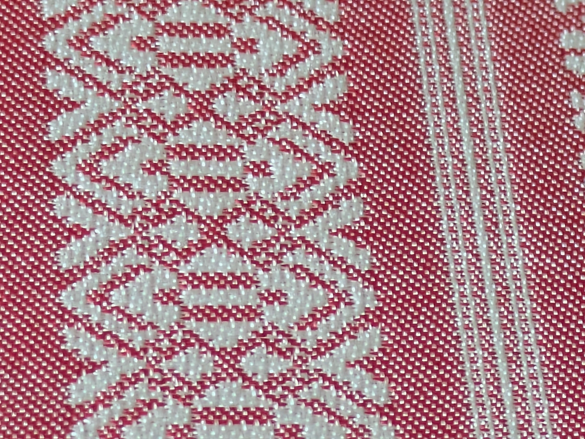 Close-up of the pink Kenjo-pattern Hakata-ori silk weave