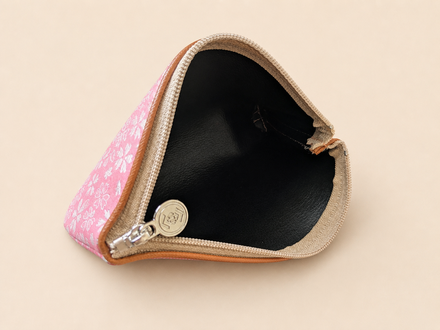 Pink Hakata-ori Sakura pouch by Sanui Textile with zipper opened to show the interior