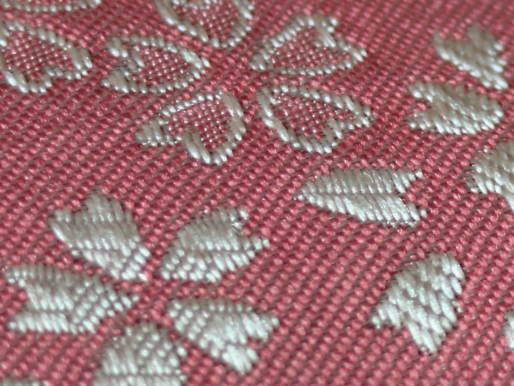Close-up of the pink Sakura-pattern Hakata-ori silk weave