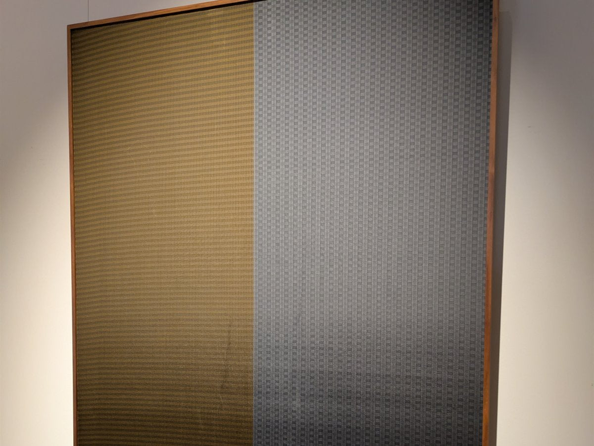 Framed textile panel for an office or hotel wall piece